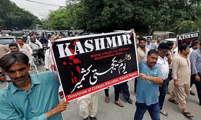 Demonstrators Hold Signs And Chant Slogans As They March In Solidarity With The People Of Kashmir, During A Rally In Karachi