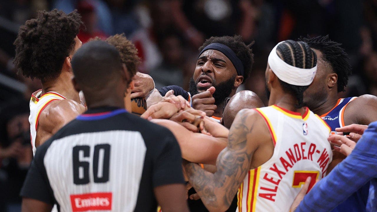 Two players ejected after scrum amid Knicks’ 50-point lead against Hawks sends referee crashing to the court