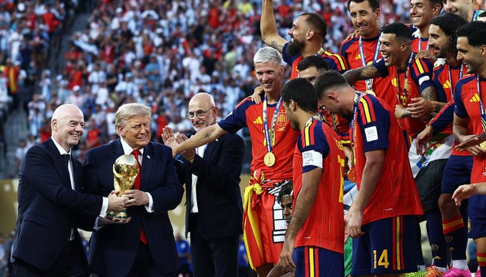 Trump mocked for lingering on stage during Spain's trophy celebration